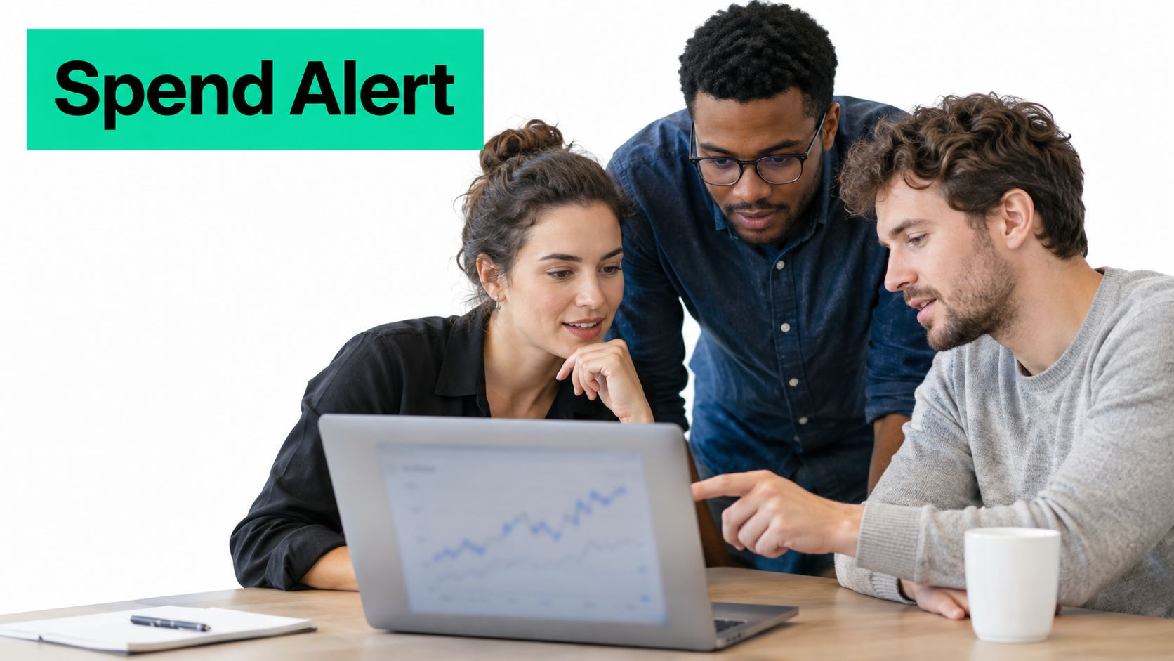 A diverse team of three business professionals looking at financial charts on a laptop in an office.